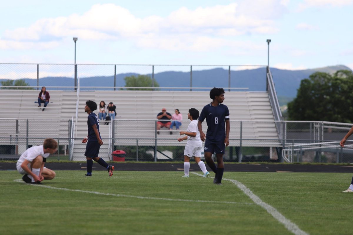 They boys JV Soccer team walking away after almost hitting the ball into the goal.
