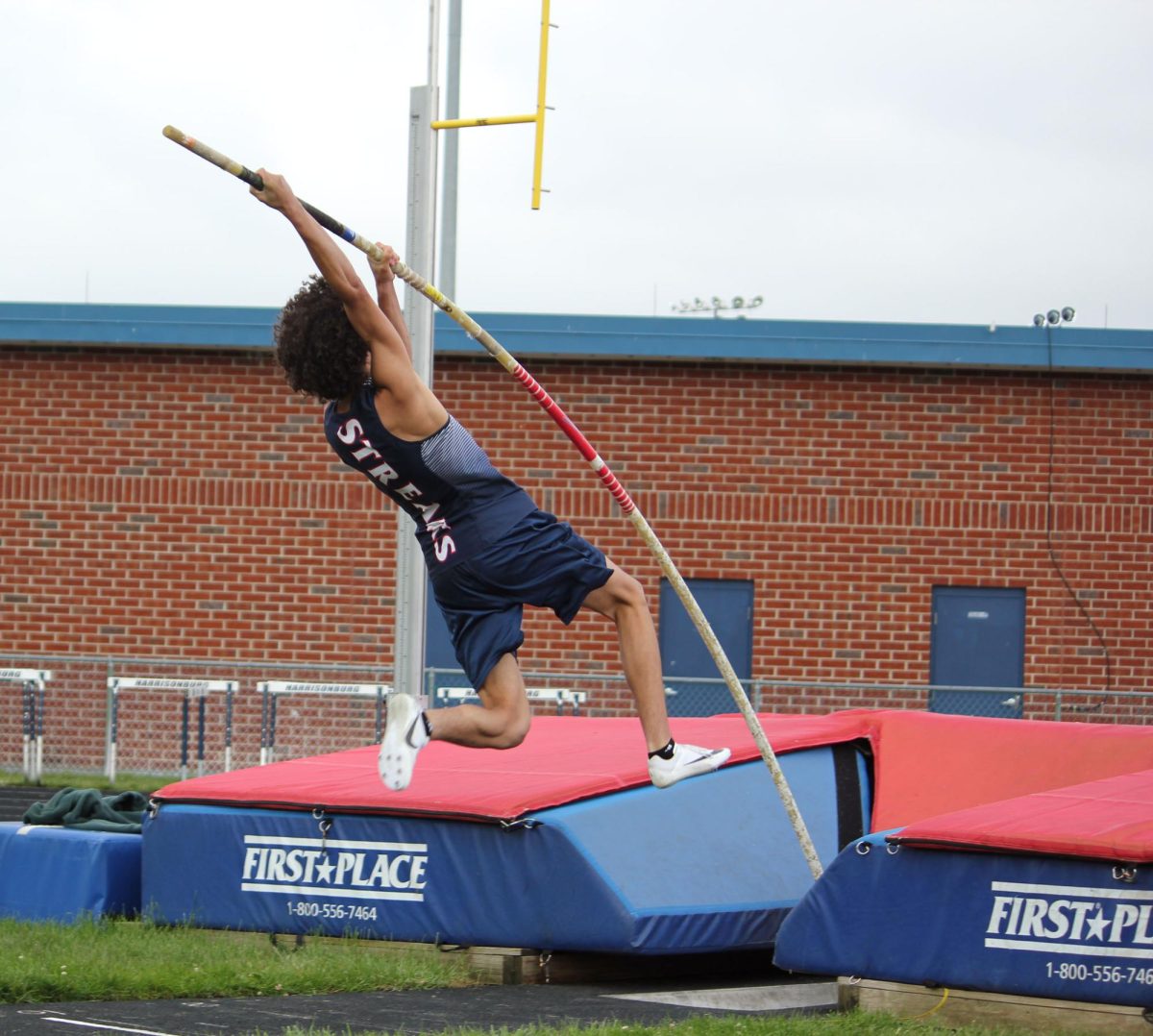 Zion Hunter leaping off the ground.