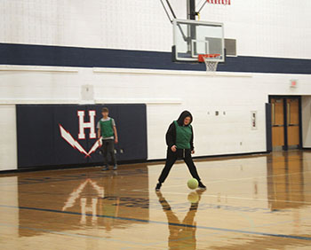 Student attempts to stop the ball