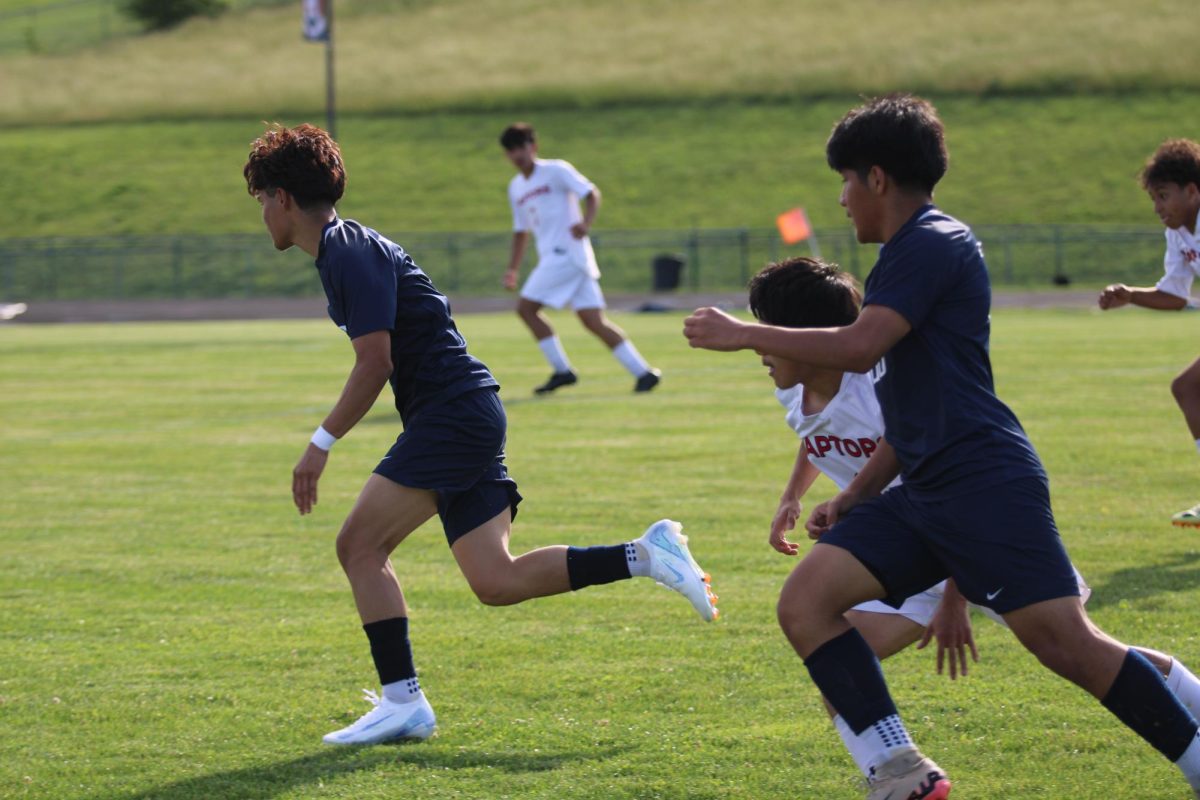 Sophomores Jefferson Castro & Josue Sontay running.