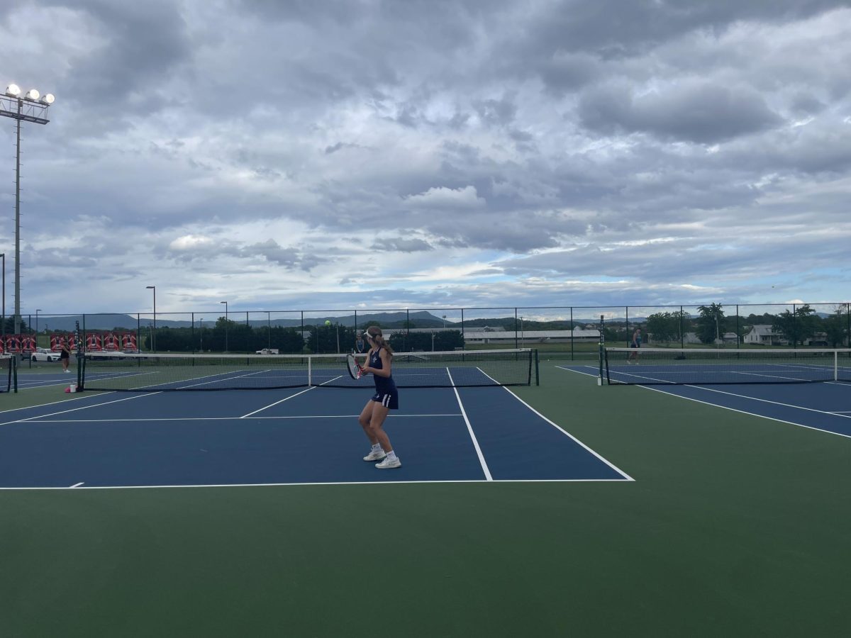 Senior Macy Waid swings the ball to score a point. 