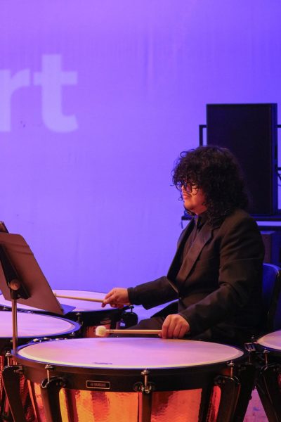 Junior Sam Wyse plays the timpani in the Concert Band piece, "Kinetic Dances."