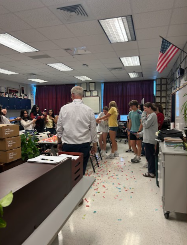 blows confetti celebrating the yearbooks coming in
