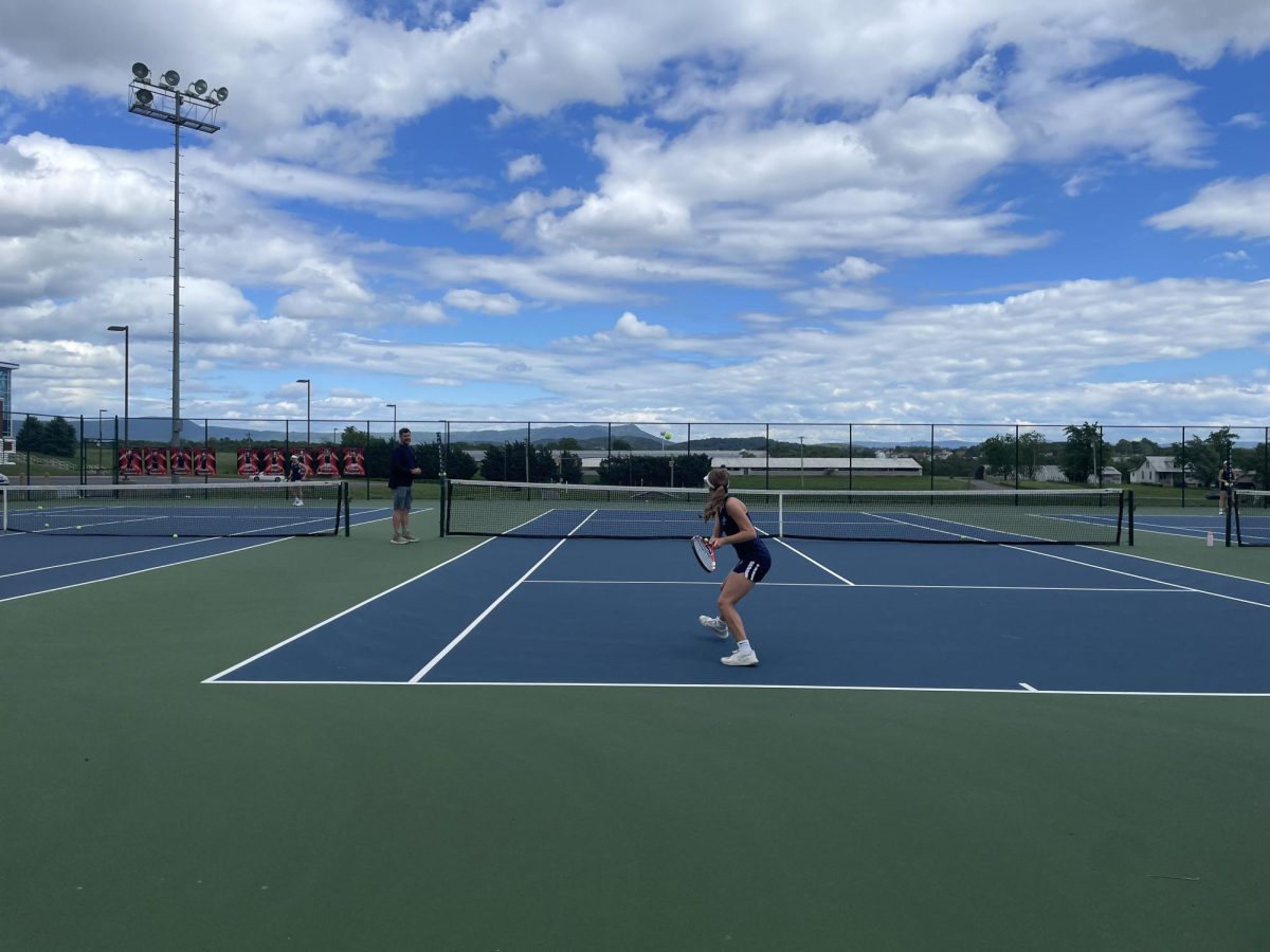 Senior Macy Waid prepares to hit the ball to her teammate.