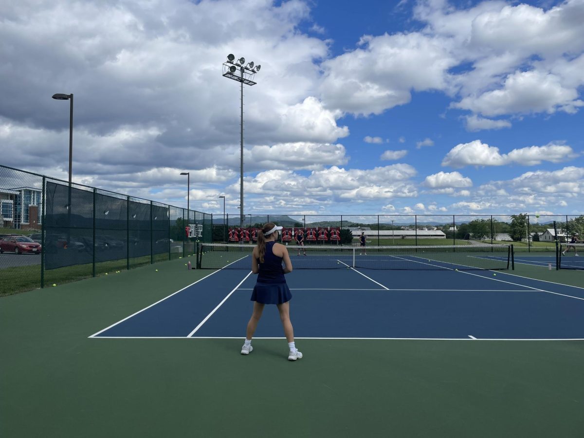 Senior Veronica Gutierrez prepares to hit the ball back. 