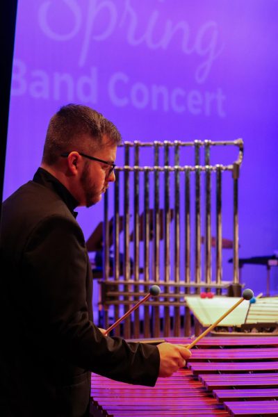 Director Daniel Upton plays the marimba during the Concert Band piece, "Kinetic Dances."