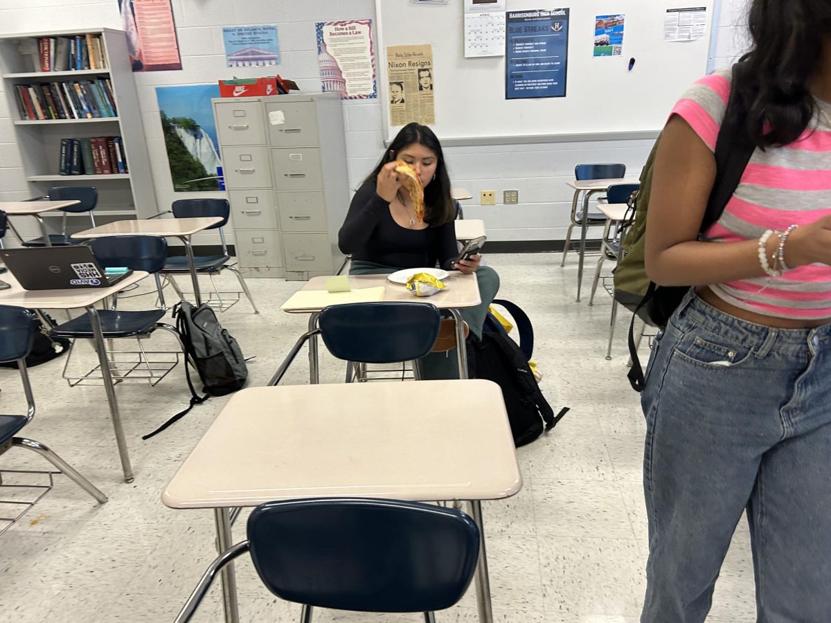 Junior Paloma Hidalgo eating her pizza.