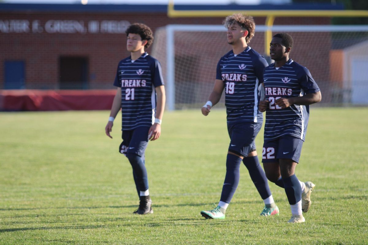 Senior Juan Chirinos, Senior Rayyan Garout, and Junior Eritier Eca getting ready to warm up.