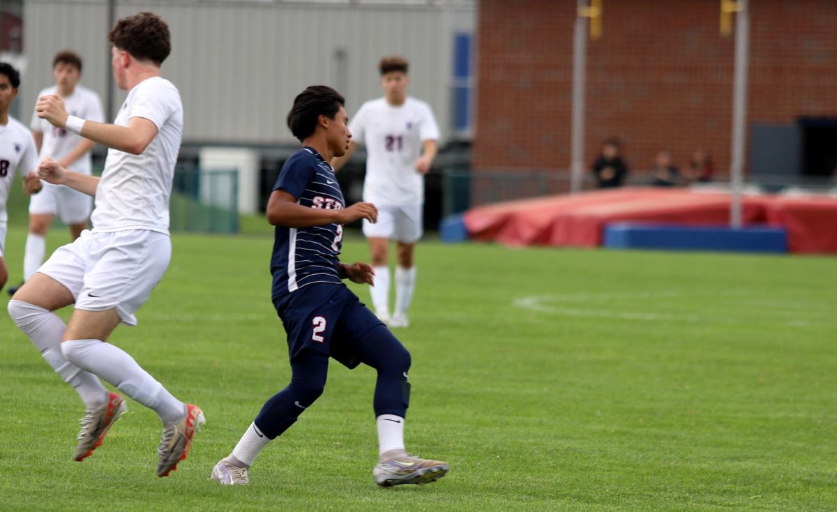 Freshman Andy running back to the ball