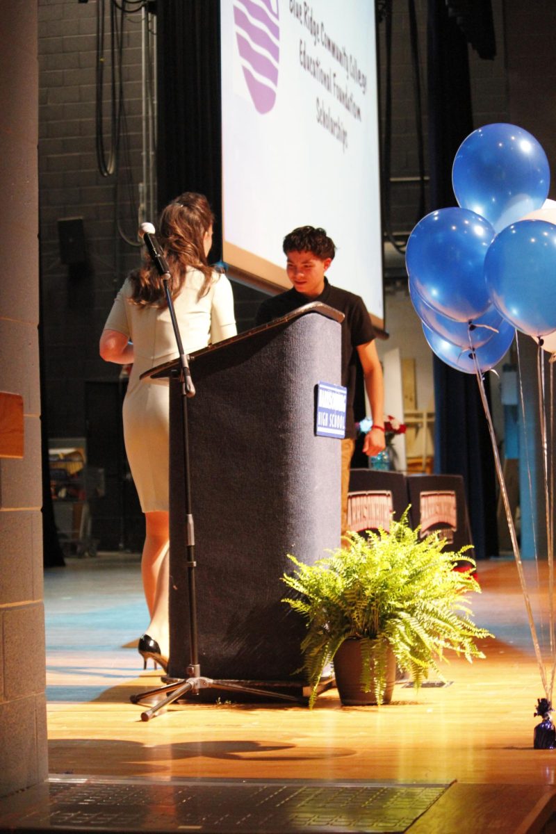 A scholarship being given to a student. 