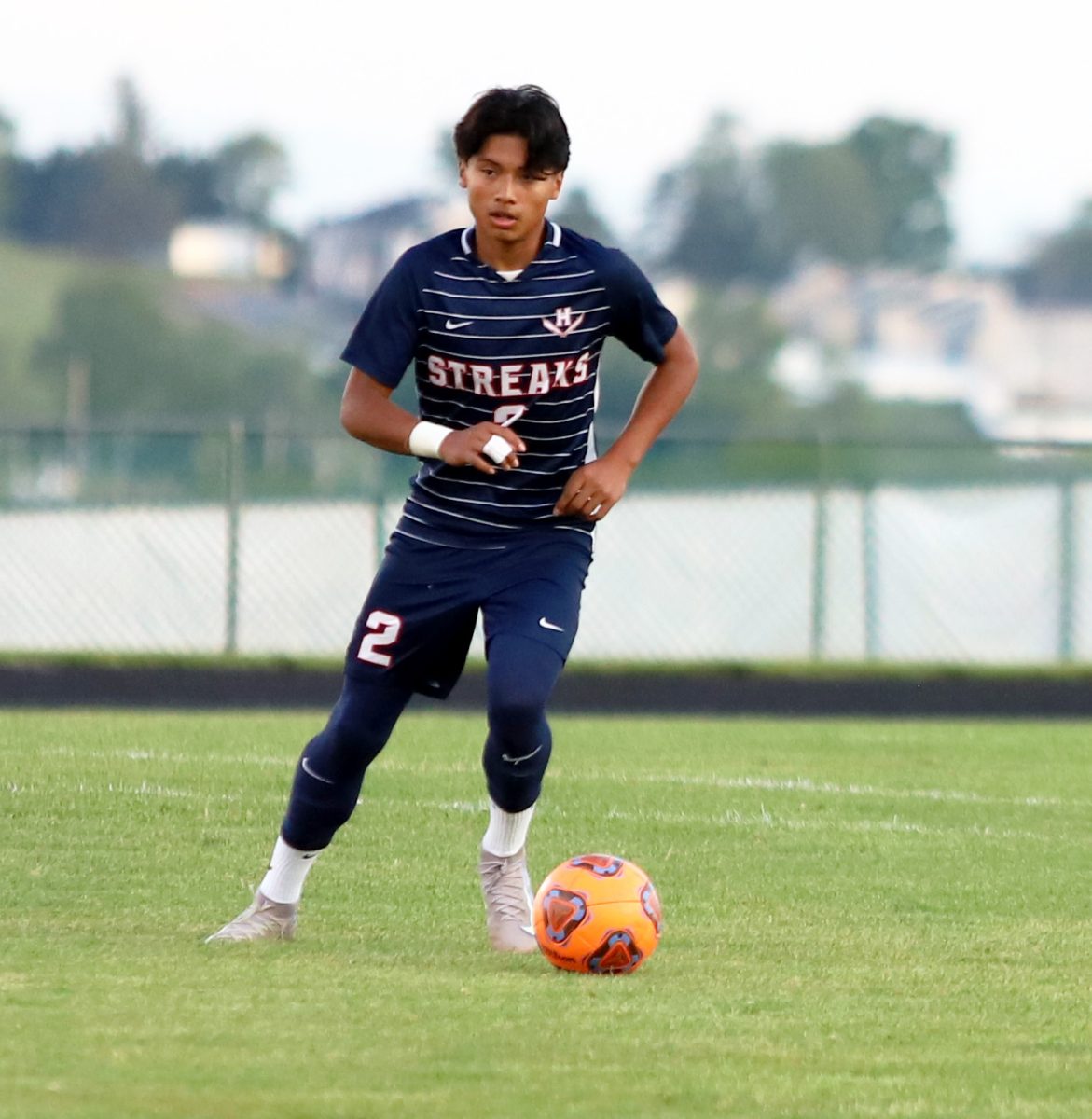 Freshman Andy Mendoza-Flores passing the ball.