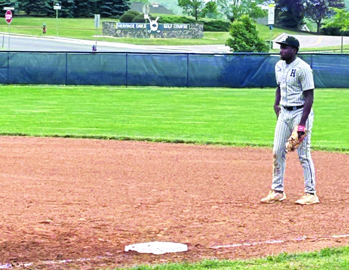 Senior Mason Smith anticipates the play at first base.