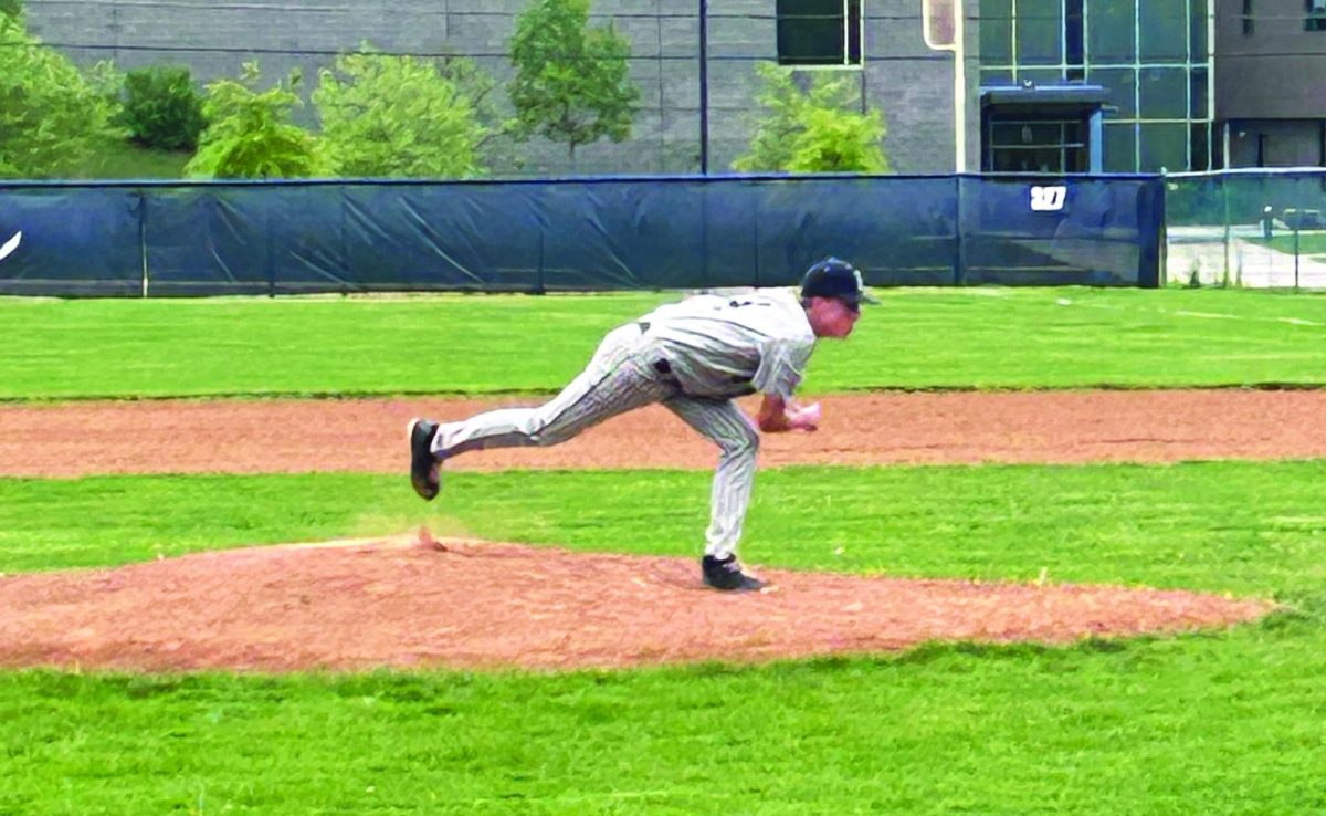 Senior Mason Smith anticipates the play at first base.