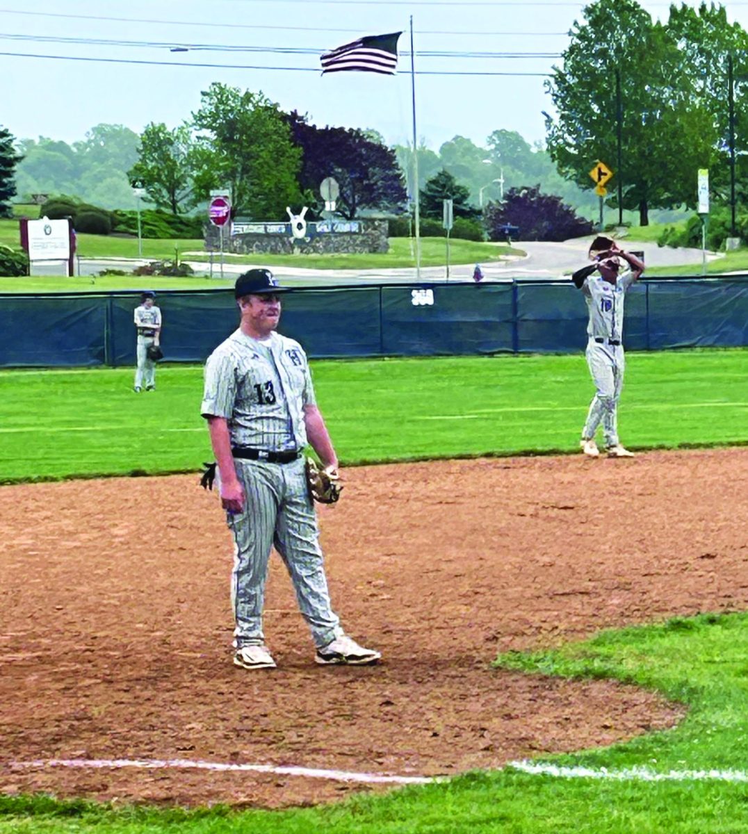 Senior Gram Vass waits for the play at third base.