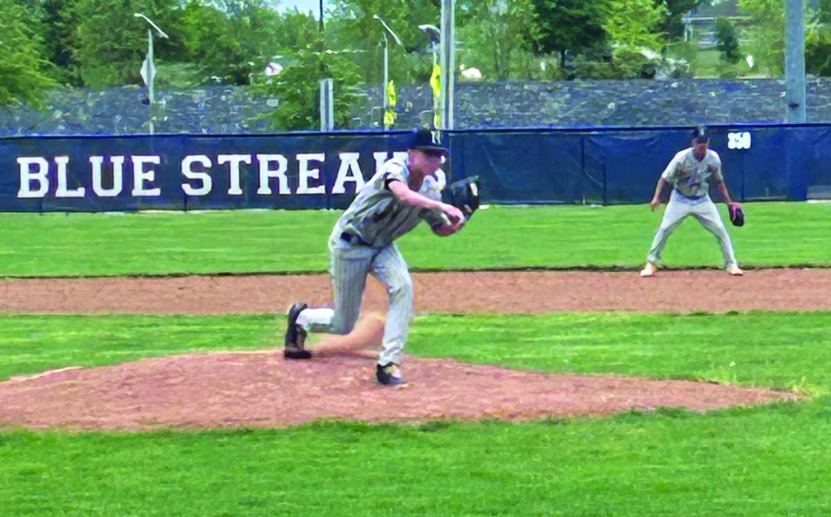Freshman Abram Wenger pitches the ball against Broadway.