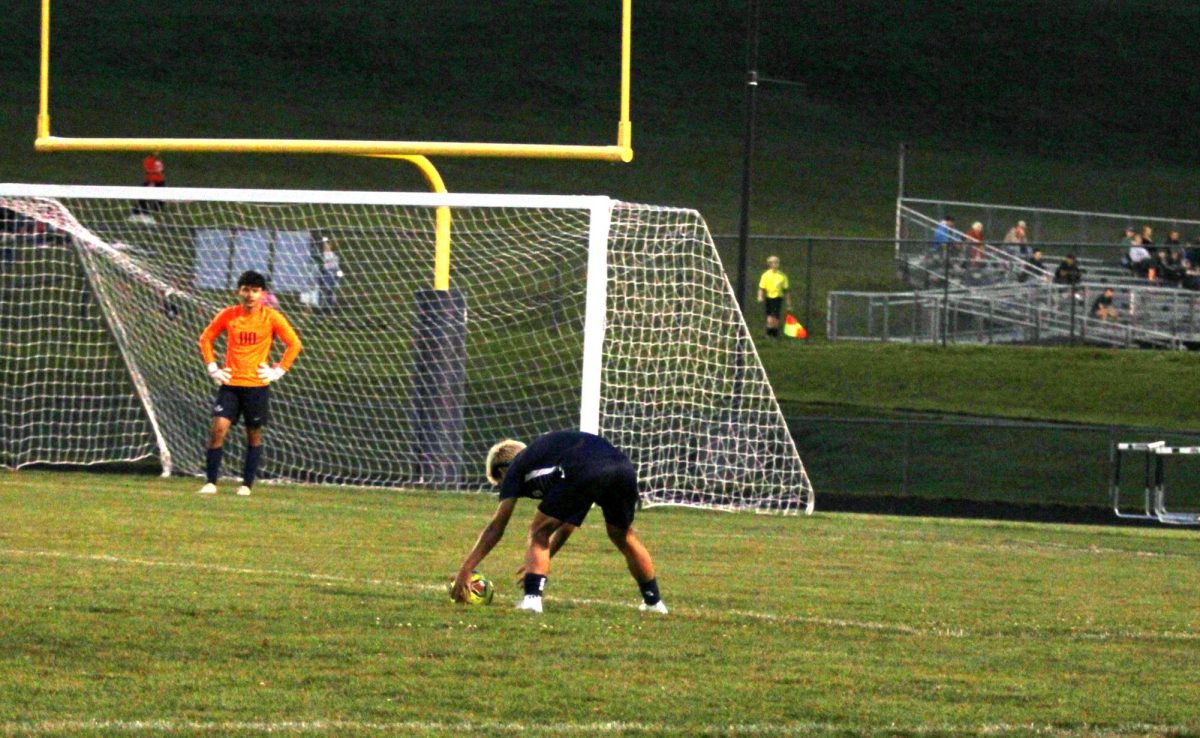 Junior Edison Rattana putting the ball on the floor 