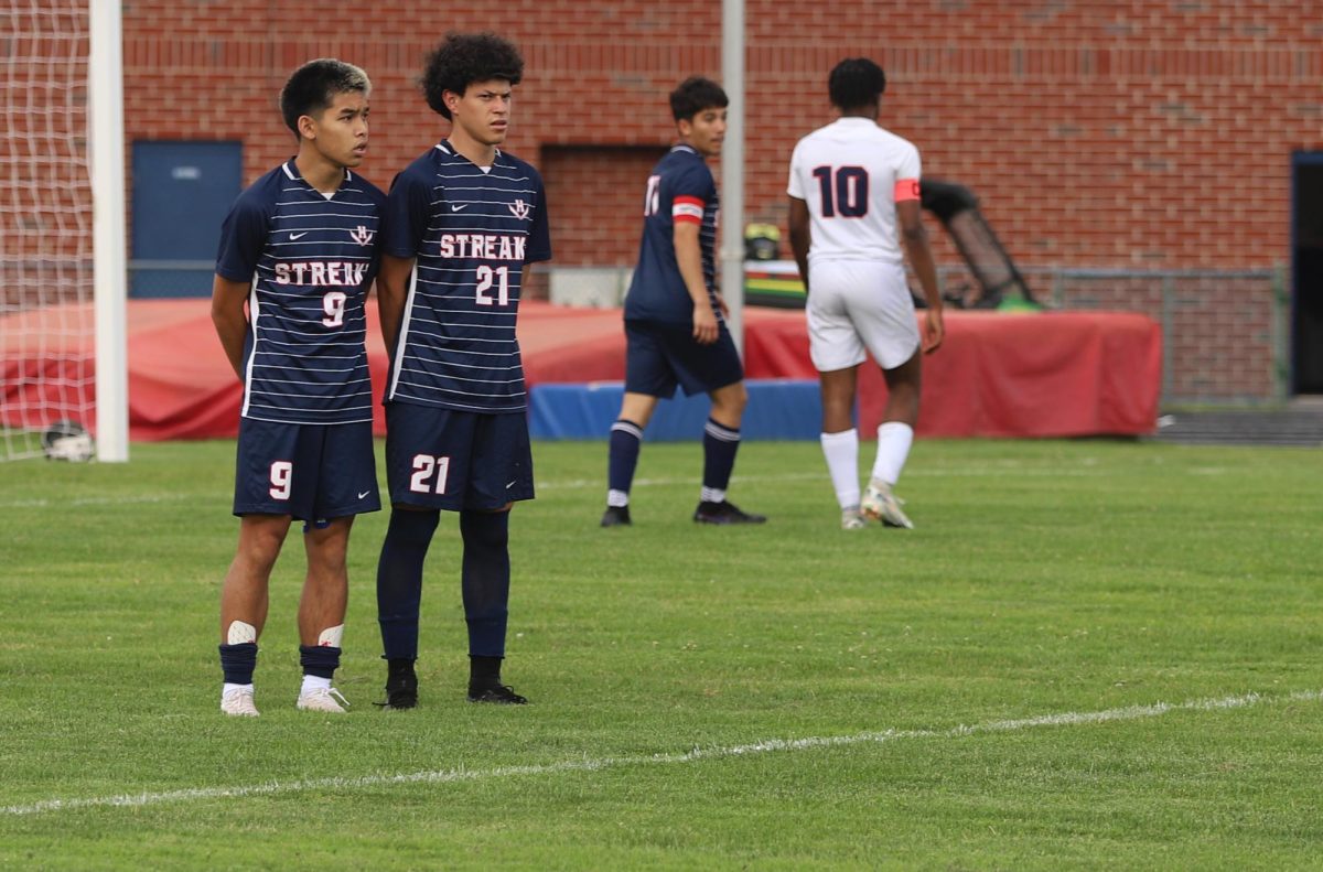 Senior Juan Chirinos Zapata and Junior Edison Rattana waiting for the opposite team to kick the ball