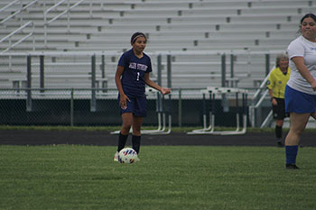 Player #1 has the ball and is ready to make her next move.