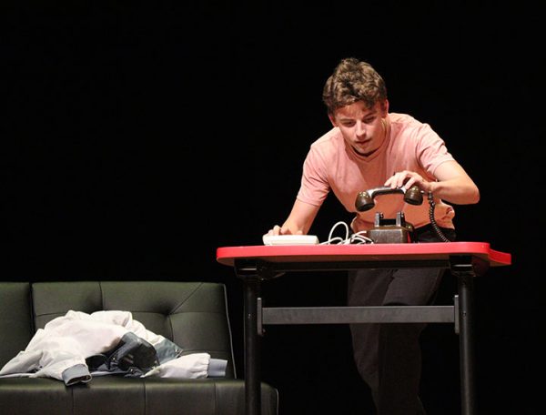 Jerry, played by Louis Gibson, listens to his voicemails.