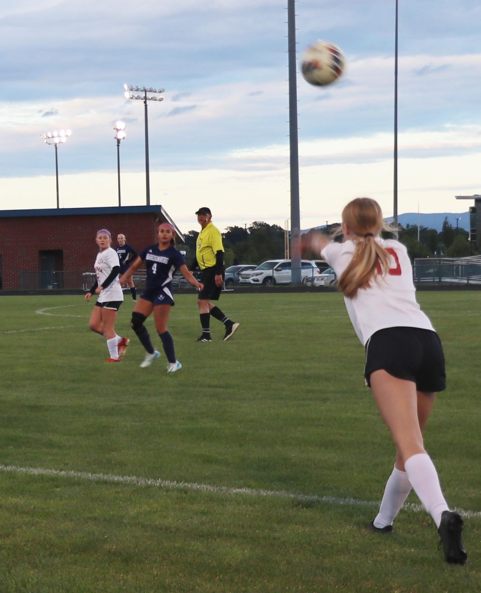 Freshman Emma Rodriguez marking on a player during a throw in