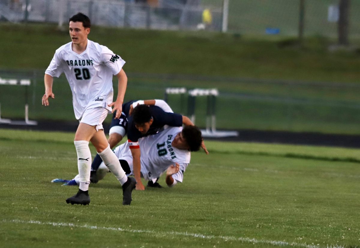 Senior Izaack Gonzalez falling onto his opponent.