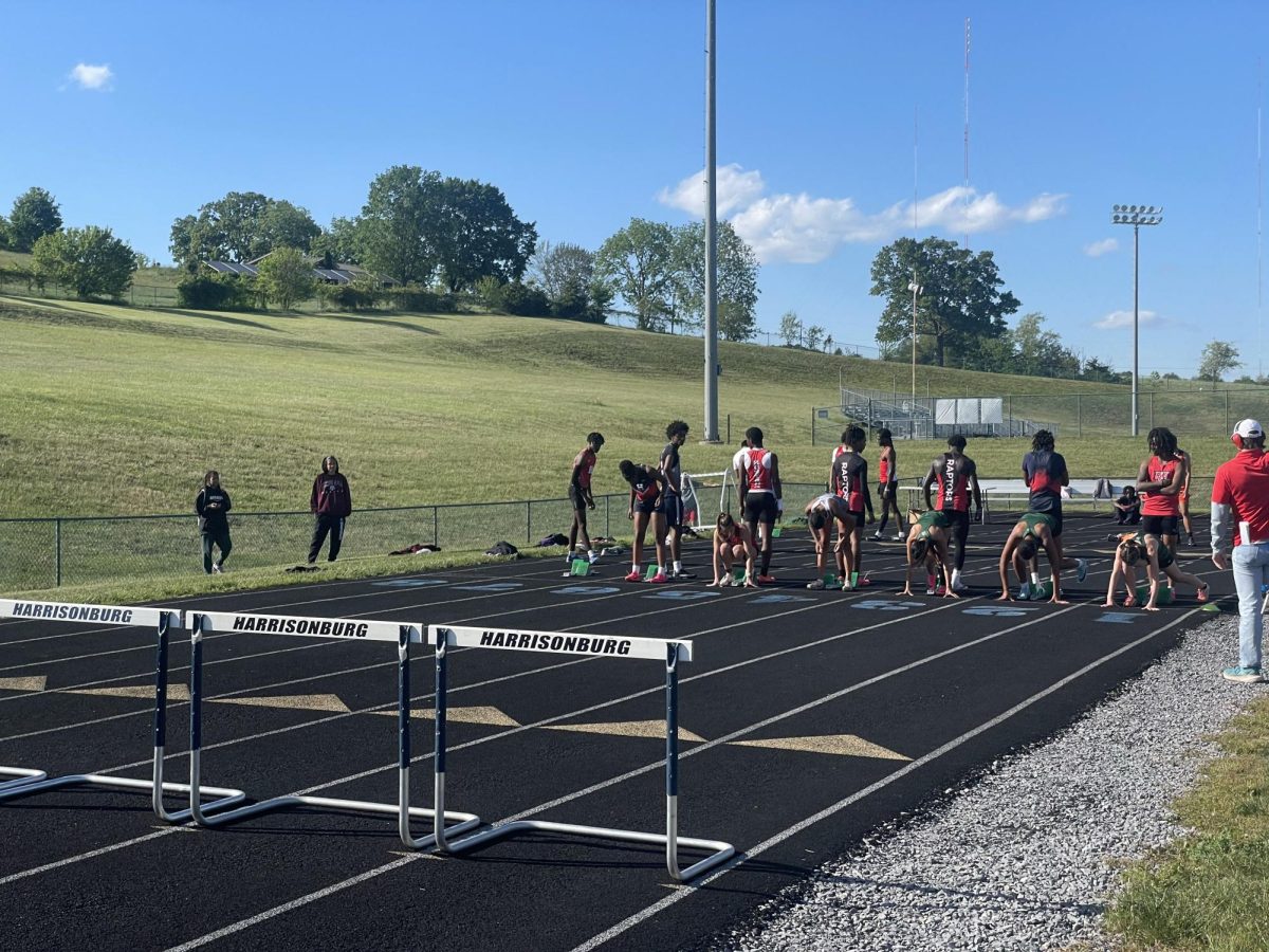 Girls prepare to run the 100 meter.