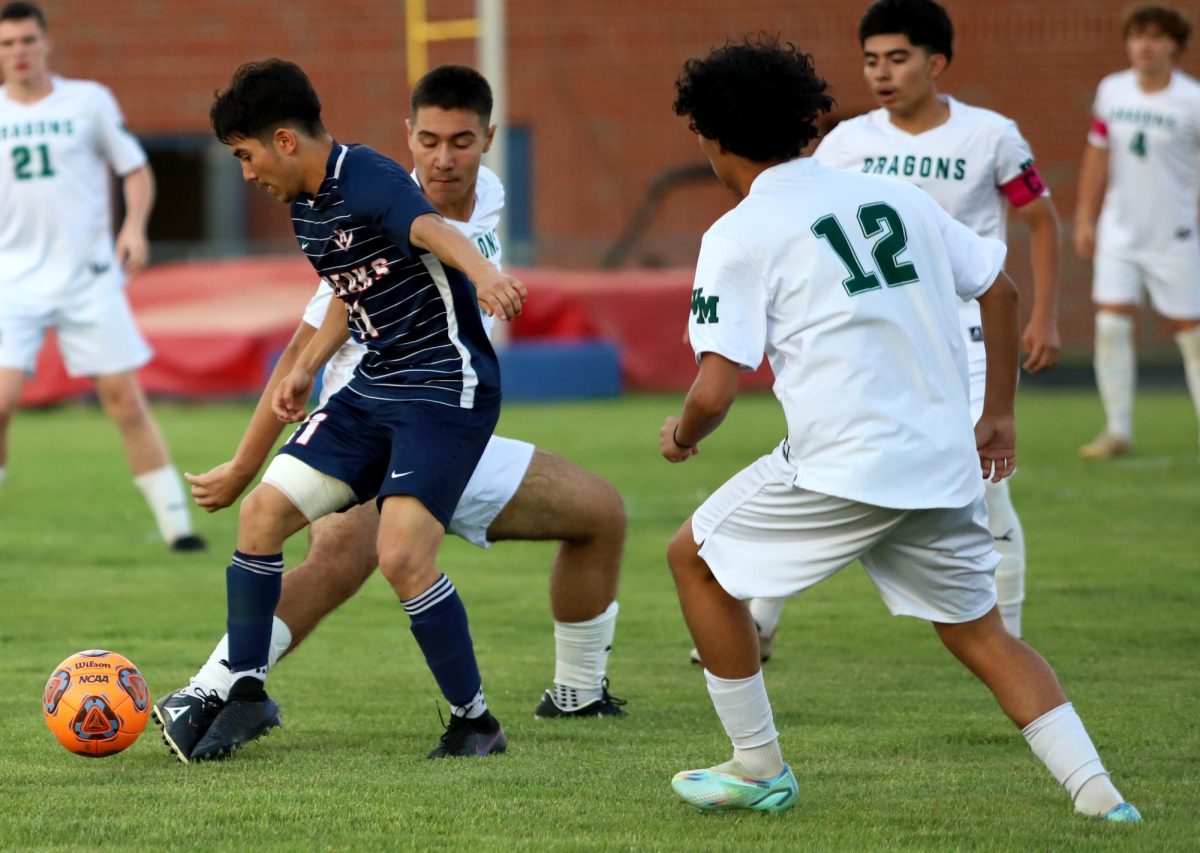 Senior Izaack Gonzalez getting the ball from his oppnents.