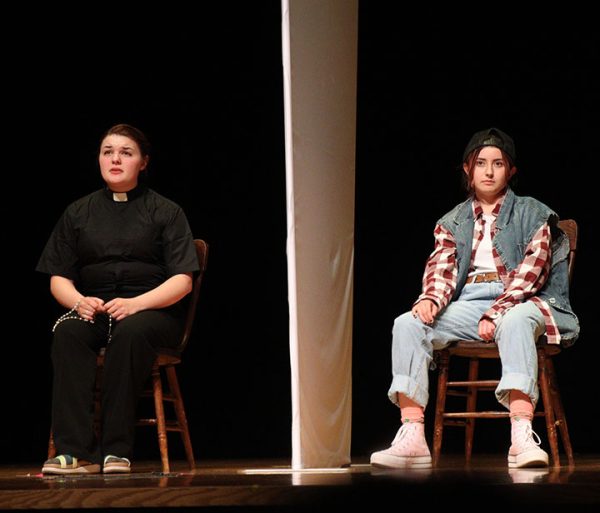Jesus, played by Junior Abby Bloss, confesses his sins to the Priest, played by Senior Hazel Pinnow.