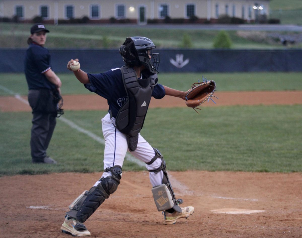 Eighth grader Xavier Perry throws the ball.