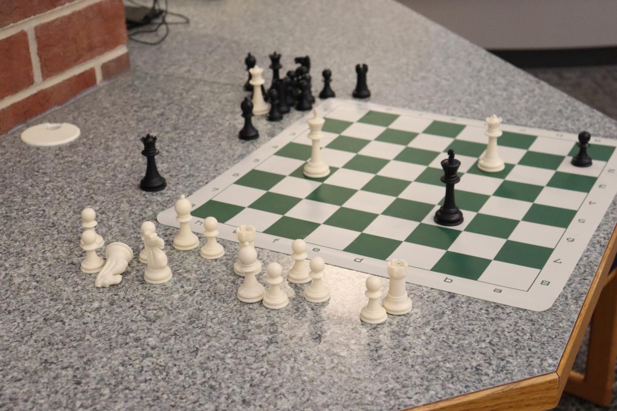 A chess board ready to be played in the library. 