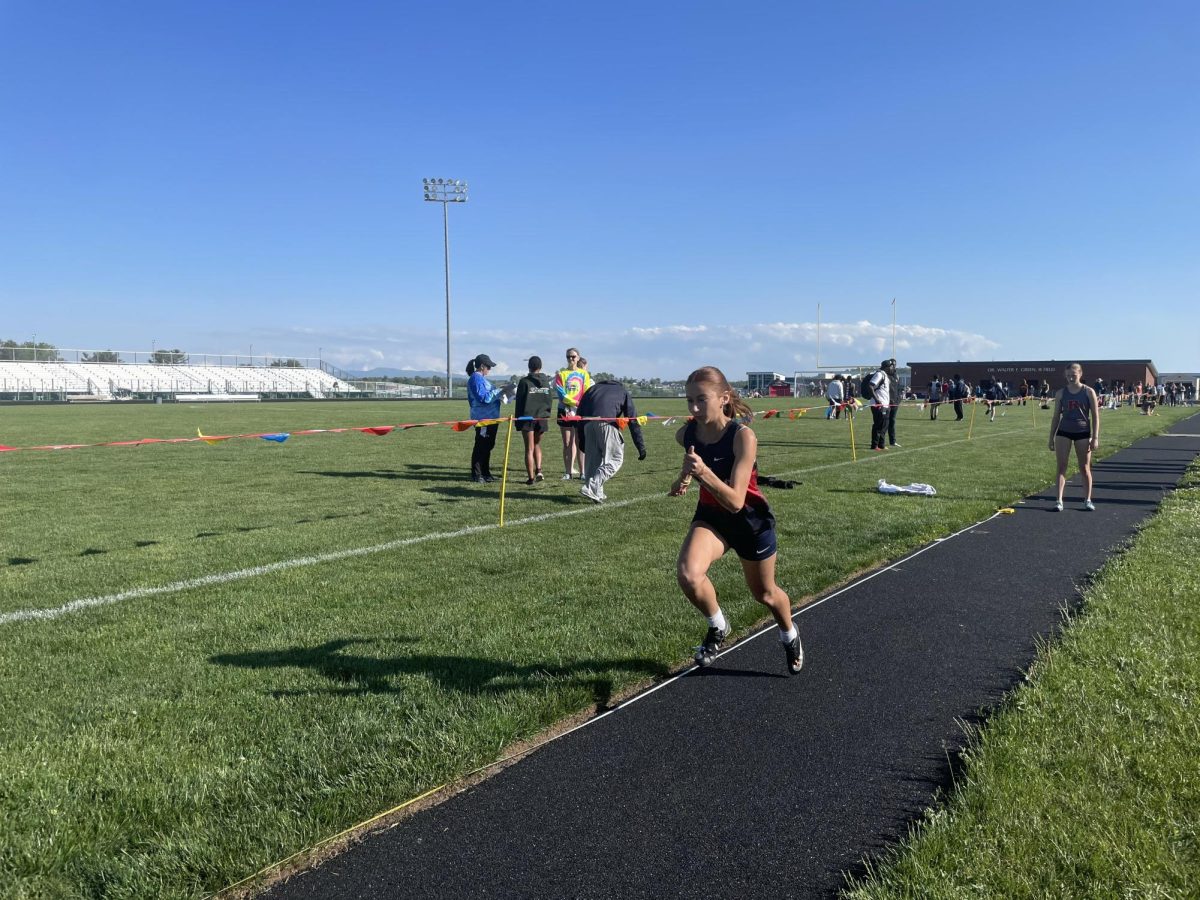 Junior Liva Jwanmery practices for long jump.