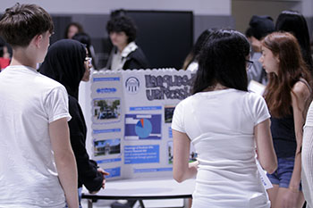Eighth graders observe a board on Longwood University.