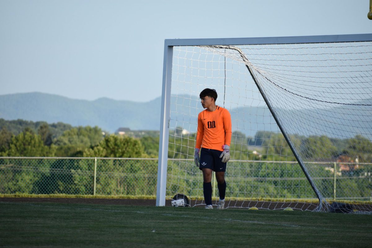 Senior Adolfo R Rivas preparing to kick.