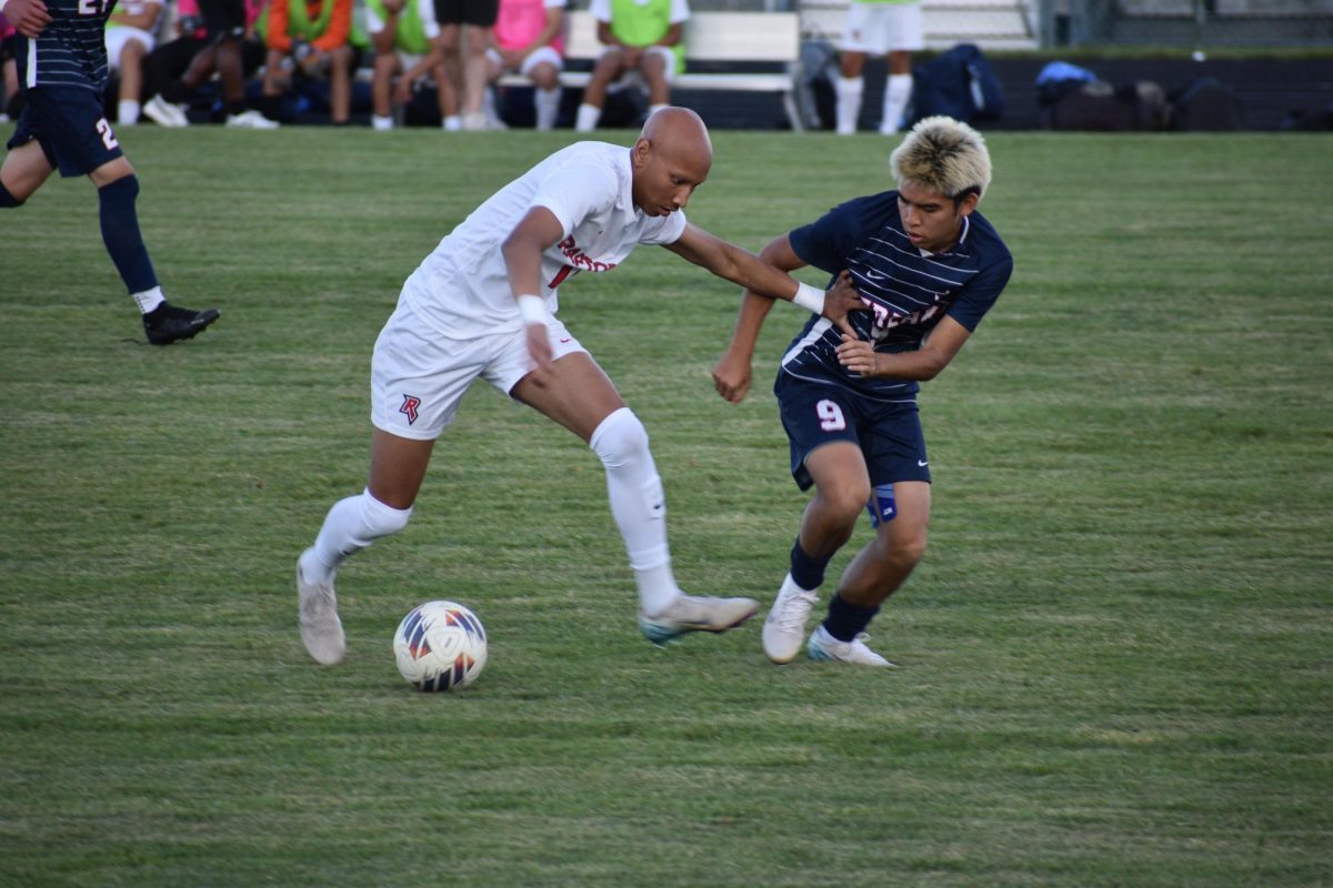Junior Edison Rattana defending the ball.