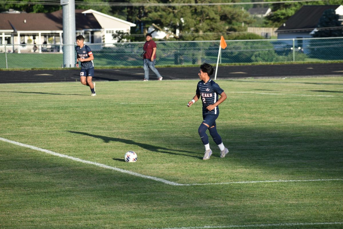 Freshman Andy Mendoza chasing the ball.