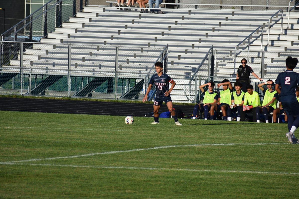Senior Rayyan Garout runs towards the ball.