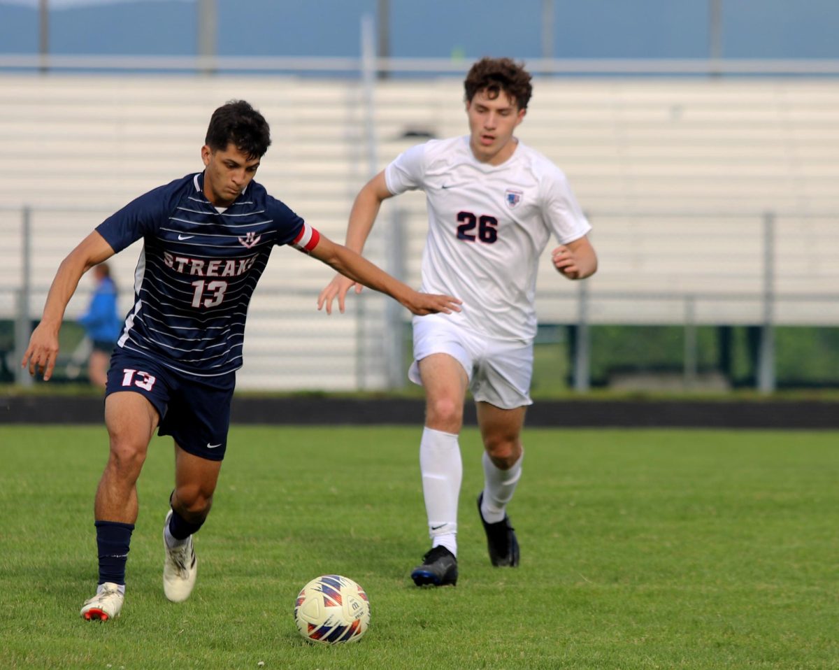 Senior Miguel Osorto kicking the ball away