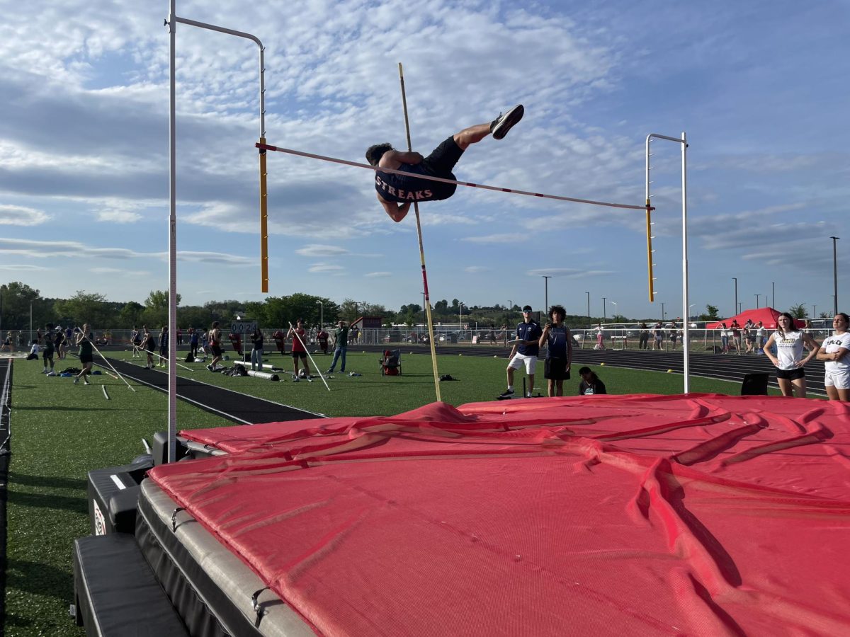 Junior Nolan Beach attempts to pole vault. 