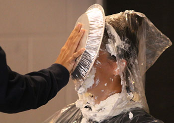 Resource Officer Miller gets pie smeared everywhere.