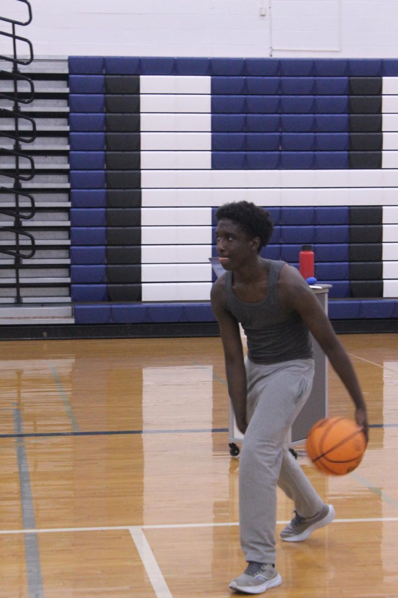 Yusuf Bakebuga was on the JV basketball team last season. He always tries his best going to open gyms, pre season, and works hard in the gym playing against his teacher. 