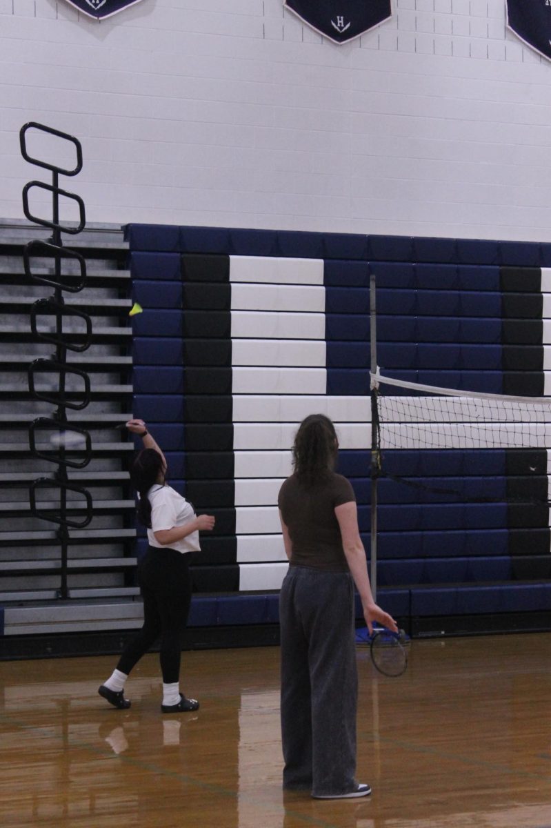 Seema Mamund is playing badminton with her classmates. She's a very hard worker and always wins in any sport.