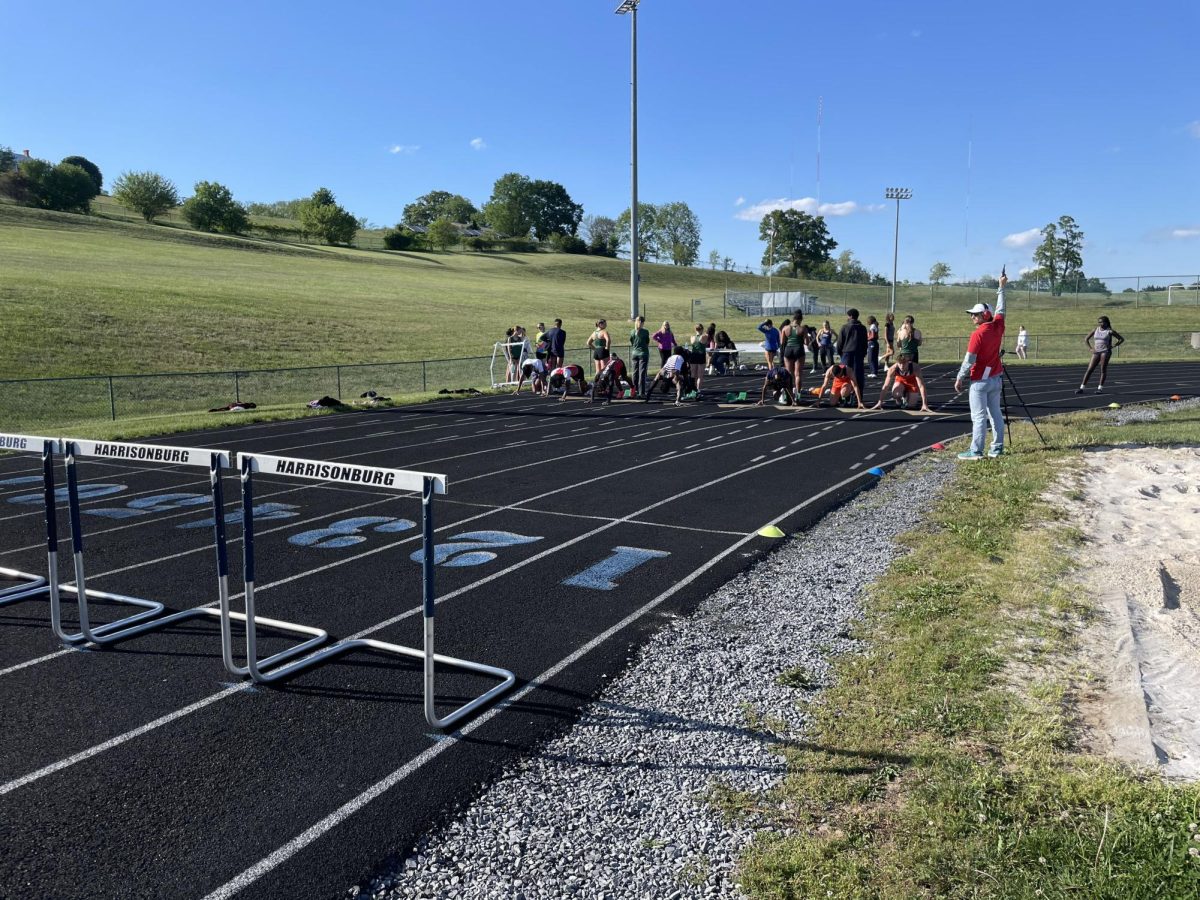 Athletes prepare to run the boys 100 meter. 