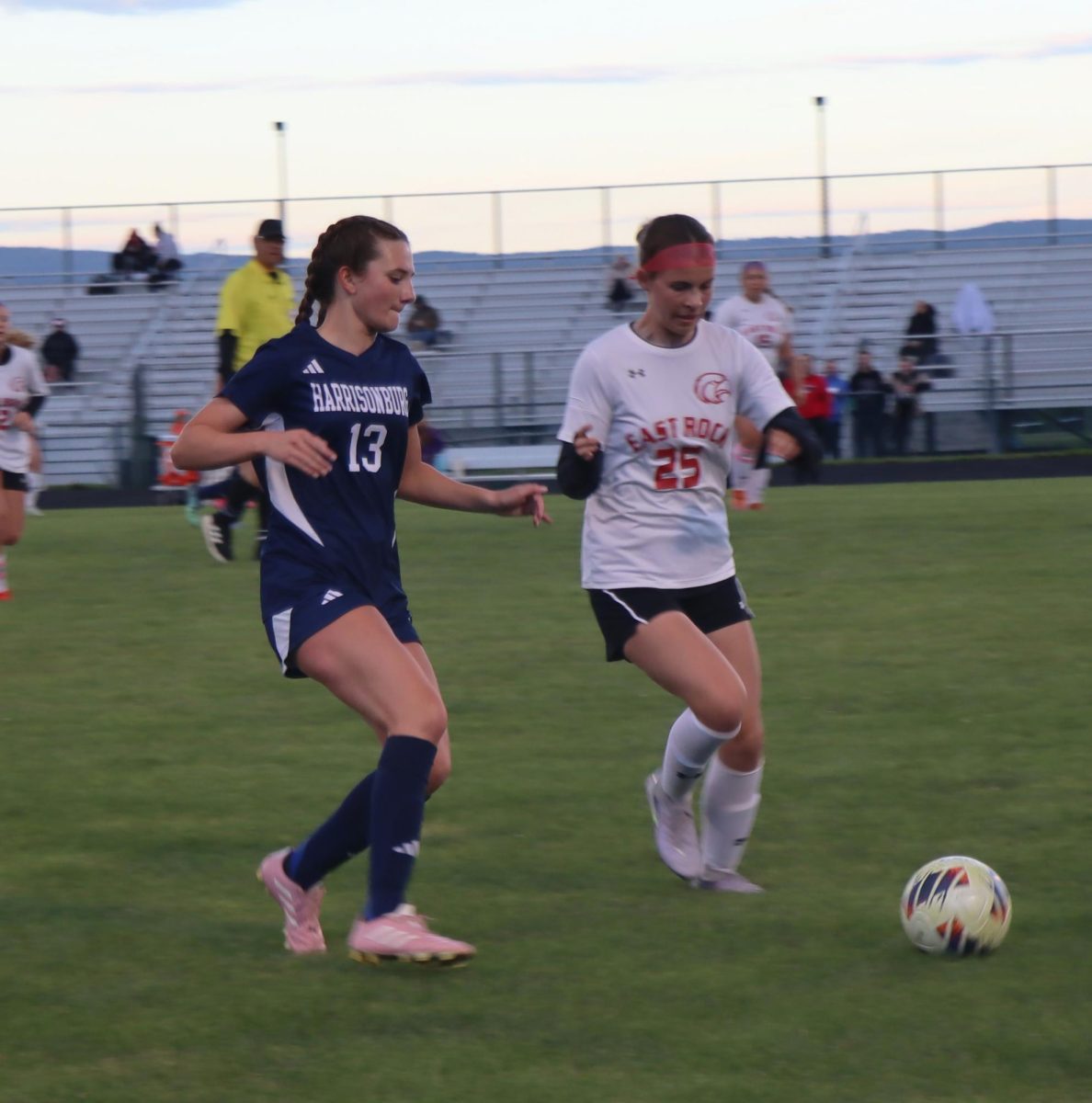 Freshman Rayna Hostetler gaining on opposing player to get the ball