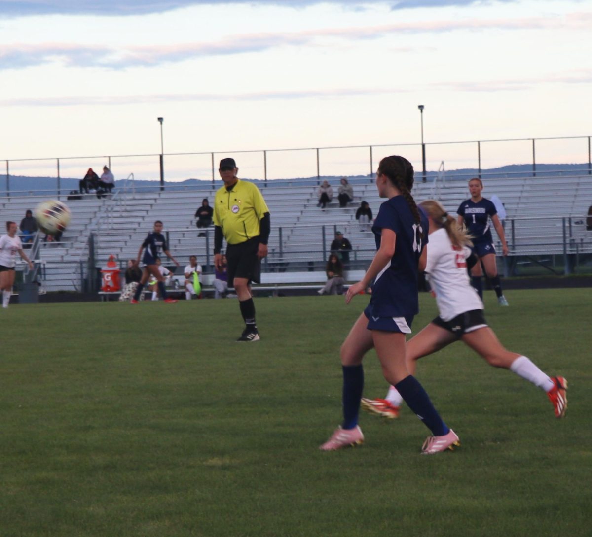Freshman Rayna Hostetler running towards the ball