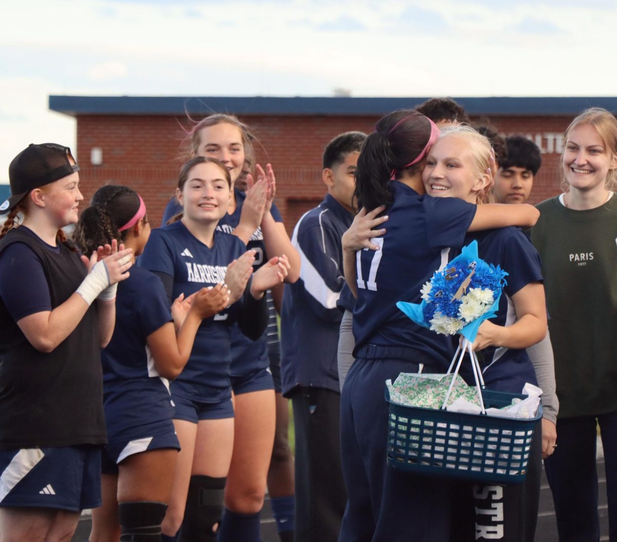 Senior Hannah O'Fallon gives her teammate a hug.