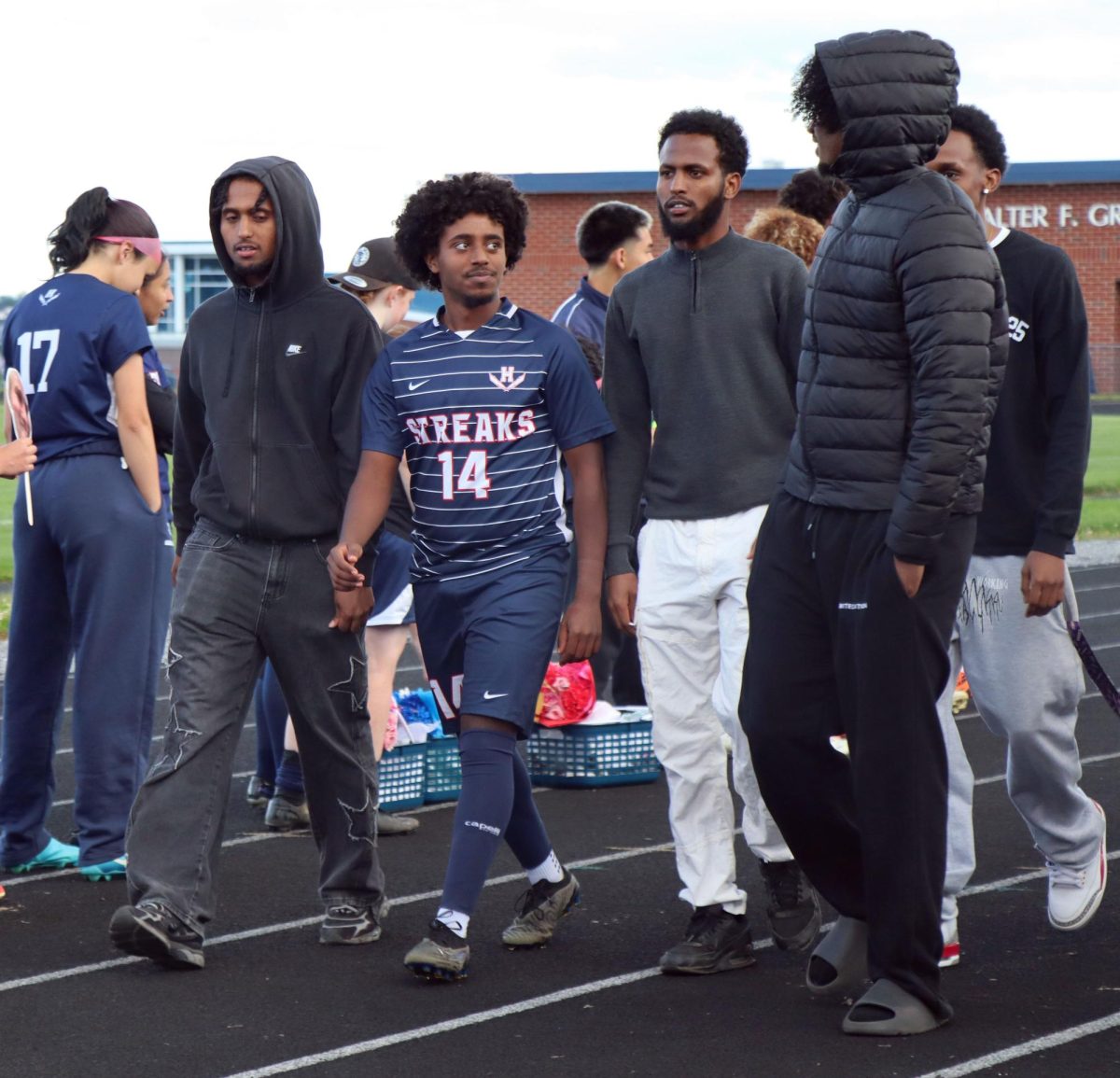Senior Temesgen Habtemichael participates in senior night with his friends.