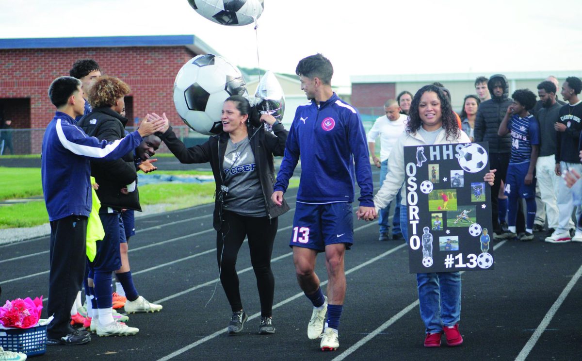 Senior Miguel Osorto Osorto is escorted by family to celebrate senior night.