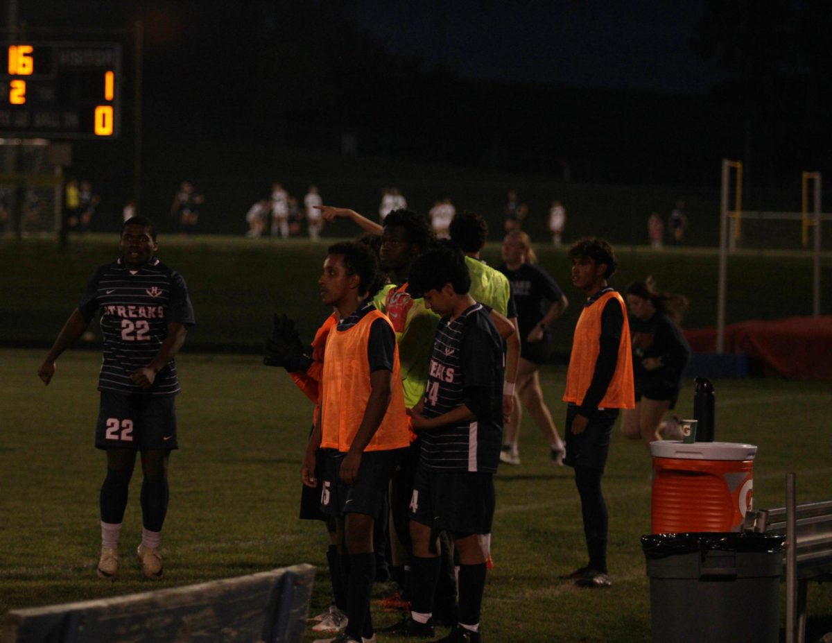 The team looking at the their team members. 