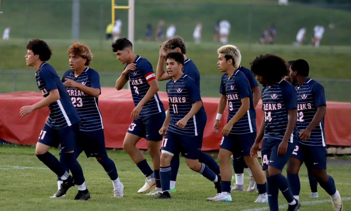 The team walking away after celebrating their first goal.