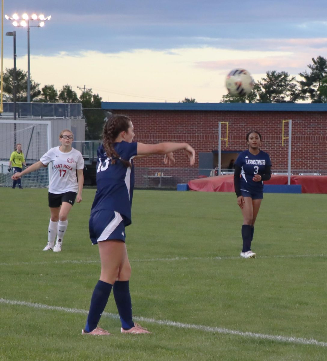 Freshman Rayna Hostetler throwing the ball to one of her teammates.